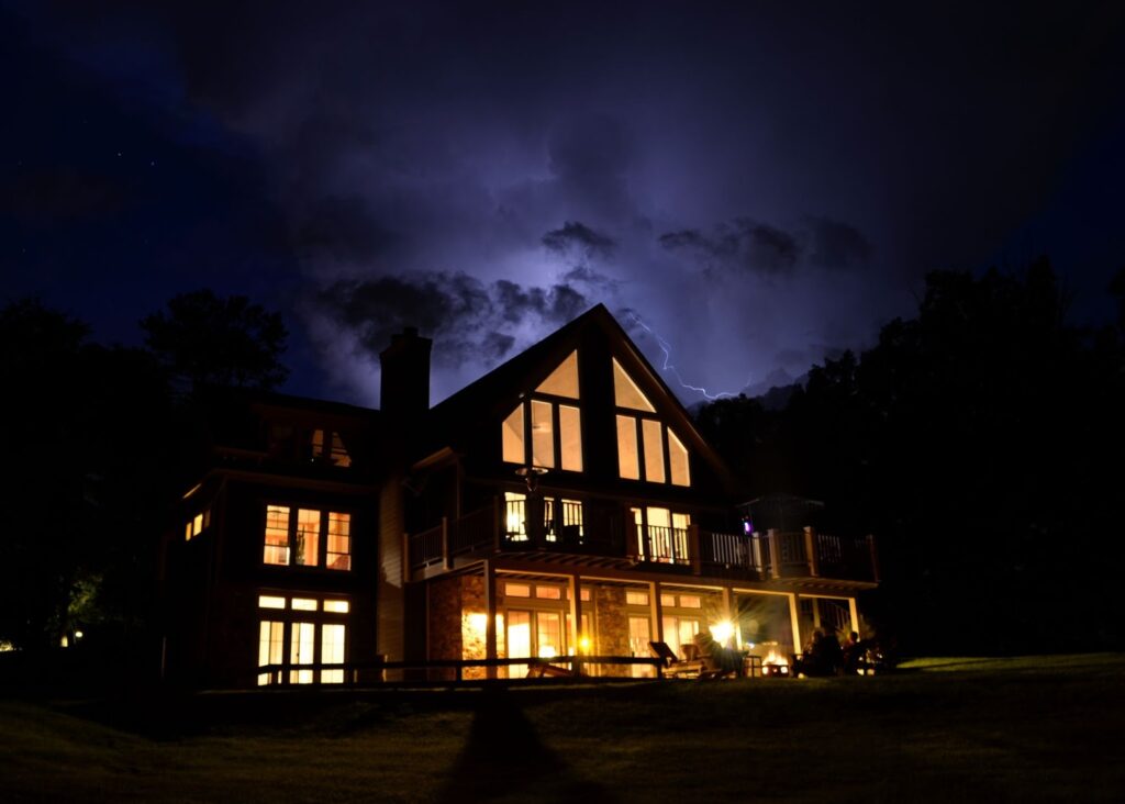 a residential home with the lights on despite a power outage